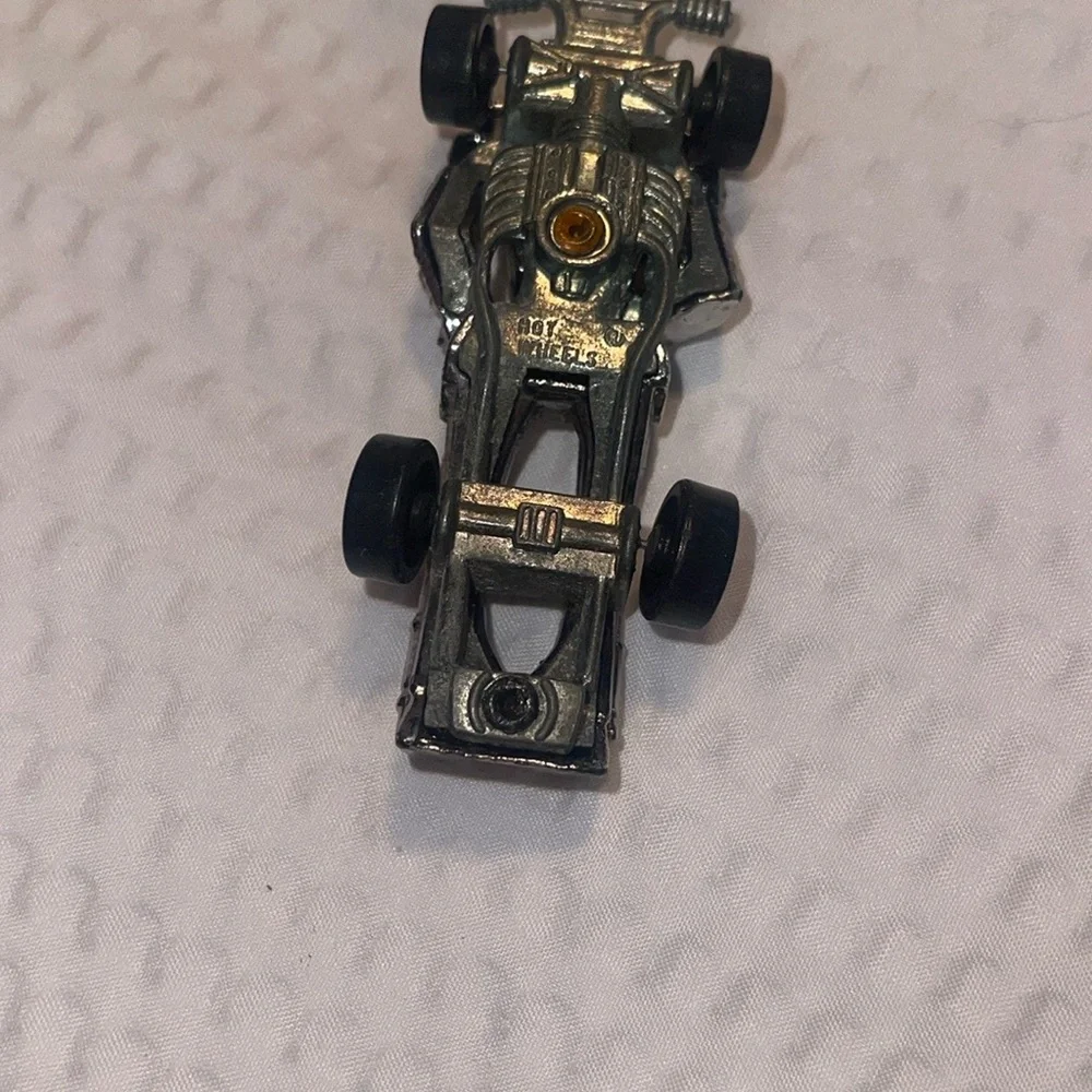 1986 Hot Wheels Silver Zombot Speed Demon Race Car Space Robot w/ Orange Gun